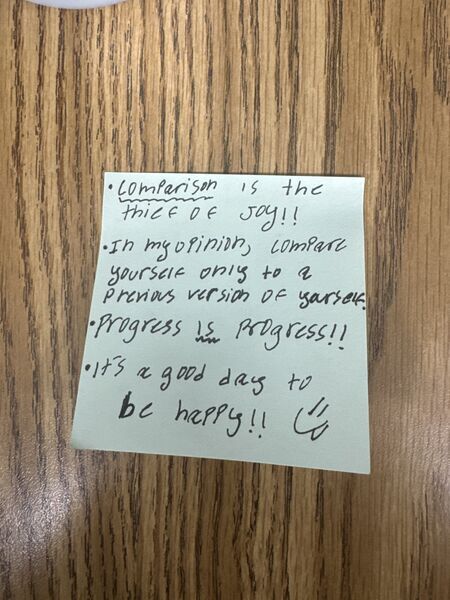 Handwritten sticky note with words of encouragement